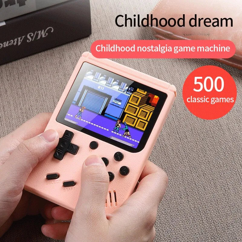 Hand holding a pink handheld game console with a screen displaying games, labeled 'Childhood nostalgia game machine' and '500 classic games'.