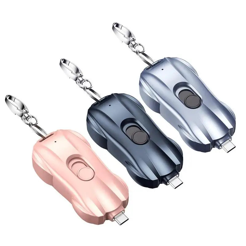 Three keychain car chargers in rose gold, black, and silver on a white background