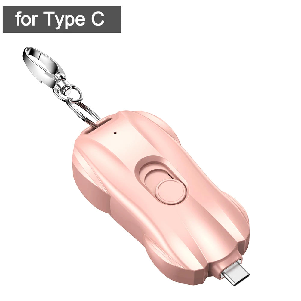 Rose gold car charger with keychain on a white background
